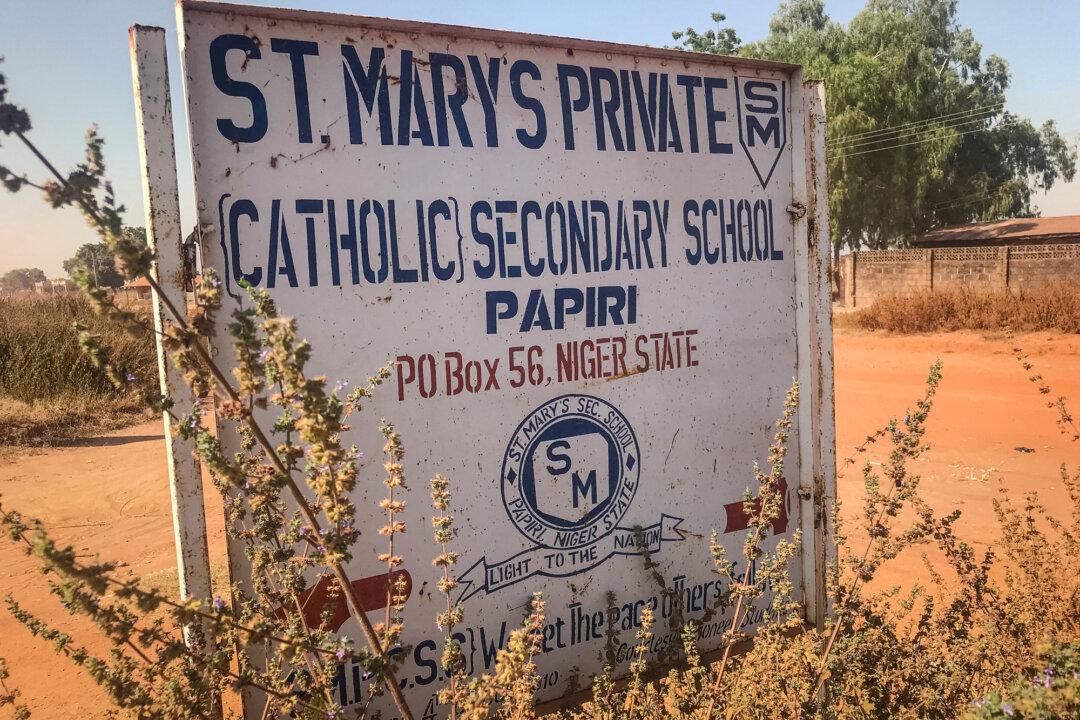 (Top) A general view of a classroom at St. Mary's Catholic School in Papiri, Agwarra local government, Niger state, Nigeria, on Nov. 23, 2025. (Bottom L) A signboard for St Mary's Private Catholic Secondary School stands at the entrance of the school in Papiri, Agwarra local government, Niger state, Nigeria, on Nov. 23, 2025. (Bottom R) A general view of empty bunk beds and scattered belongings inside a student dormitory at St. Mary's Catholic School in Papiri, Agwarra local government, Niger state, Nigeria, on Nov. 23, 2025. (Ifeanyi Immanuel Bakwenye/AFP via Getty Images)