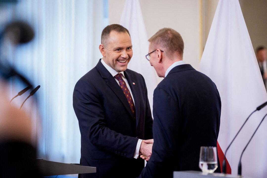 Poland's President Karol Nawrocki (L) and Latvia's President Edgars Rinkevics shake hands during a press conference at the Castle in Riga, Latvia, on Dec. 11, 2025. (Gints Ivuskans/AFP via Getty Images)