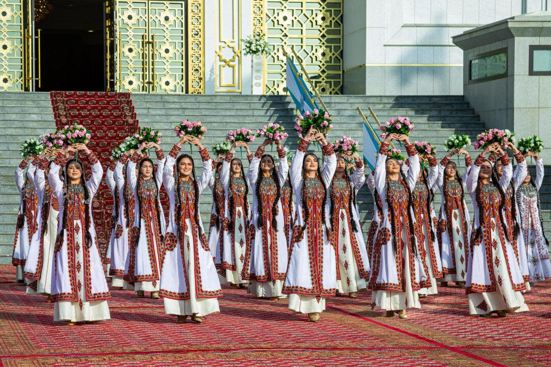 Traditional dancers perform during the opening ceremony and inauguration of the renovated Monument of Neutrality in Ashgabat, Turkmenistan, on Dec. 11, 2025, on the eve of the 30th anniversary of Turkmenistan's neutrality. (Nikolay Vavilov/AFP via Getty Images)