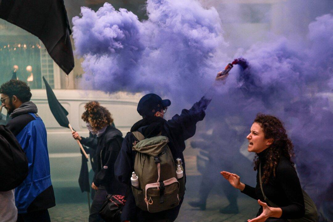 Protesters take part in a demonstration during a general strike against a labor code reform project, called by the country's two main unions in Lisbon, Portugal, on Dec. 11, 2025. Widespread disruption hit Portuguese air travel and trains, hospitals, and schools as the unions called the biggest nationwide strike action for more than a decade, protesting against a draft law aiming to simplify firing procedures, extend the length of fixed-term contracts, and expand the minimum services required during a strike. (Patricia De Melo Moreira/AFP via Getty Images)