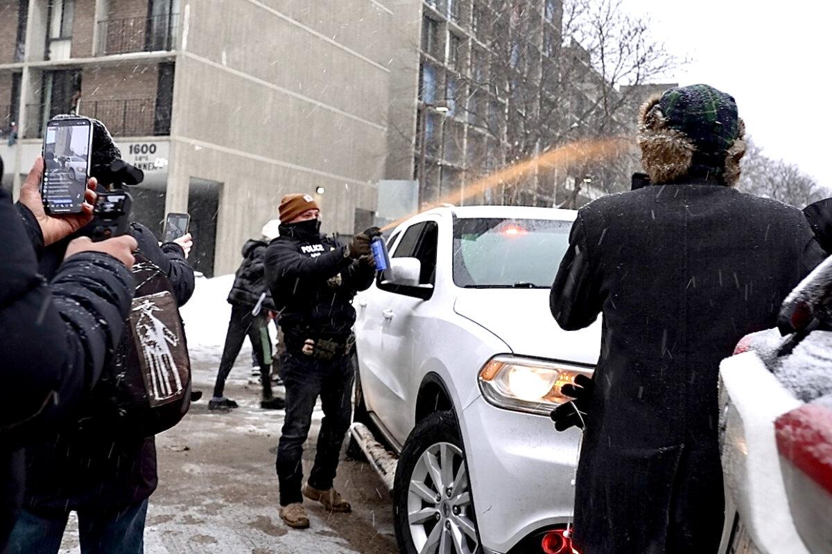 Activists confronted a group of Immigration and Customs Enforcement officers in the largely Somali neighborhood of Cedar-Riverside in Minneapolis on Dec. 9, 2025. (AP Photo/Mark Vancleave)