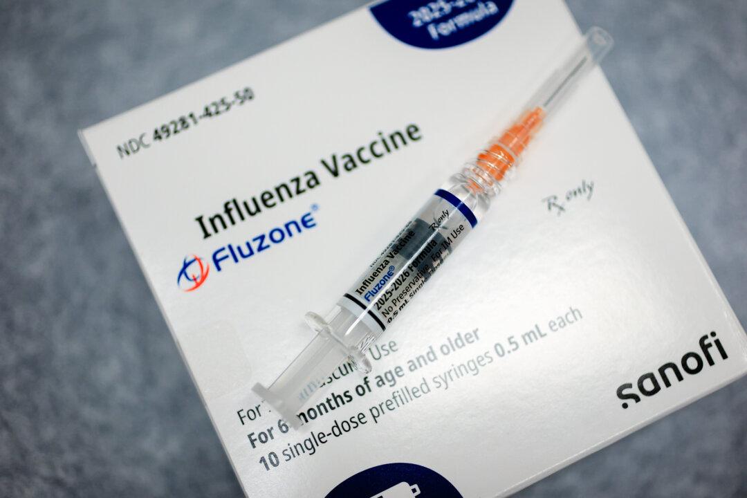 An influenza vaccine is prepared for a patient at a pediatric office in Coral Gables, Fla., on Sept. 12, 2025. U.S. guidelines recommend annual flu shots starting at six months, but many peer countries do not treat it as a routine vaccine for all children. (Joe Raedle/Getty Images)