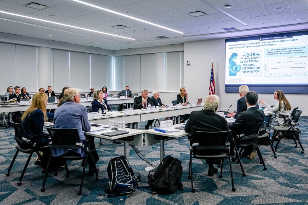 The Advisory Committee on Immunization Practices meets in Chamblee, Ga., on Sept. 18, 2025. On Dec. 5, the panel voted to advise the CDC to stop recommending a hepatitis B shot within 24 hours of birth for infants whose mothers test negative for the virus. (Elijah Nouvelage/Getty Images)