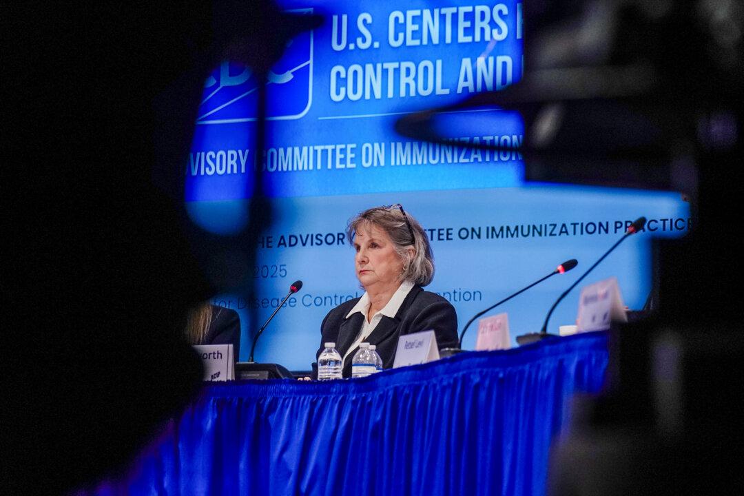 CDC adviser Vicky Pebsworth listens during a meeting of the Centers for Disease Control and Prevention’s (CDC) Advisory Committee on Immunization Practices (ACIP) at CDC headquarters in Atlanta on Dec. 4, 2025. (Elijah Nouvelage/Getty Images)