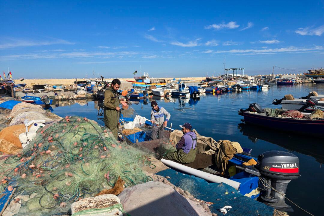 Fishermen prepare their net at a port in Tripoli, Libya, on Dec. 12, 2025. (Mahmud Turkia/AFP via Getty Images)