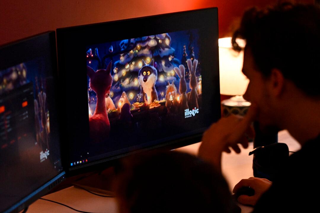 Employees work on computers at the office of Illogic Studios in Montpellier, southern France, on Dec. 12, 2025. At a time when multinationals are being criticized for using artificial intelligence in their advertising, a Christmas ad created by a French animation studio for Intermarché is crossing borders on social media, racking up more than 20 million views as of Dec. 10, according to the head of the French retailer. (Sylvain Thomas/AFP via Getty Images)