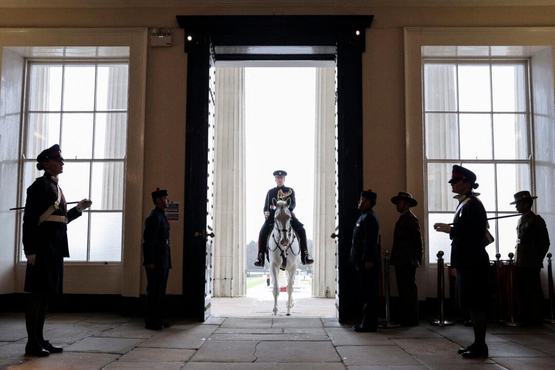An adjutant rides “Otto” up the steps into the college during the No. 251 Sovereign's Parade at the Royal Military Academy in Sandhurst, southwest of London, on Dec. 12, 2025. The parade marks the completion of 44 weeks of intensive training for the Officer Cadets of Commissioning Course 251. (Adrian Dennis/AFP via Getty Images)