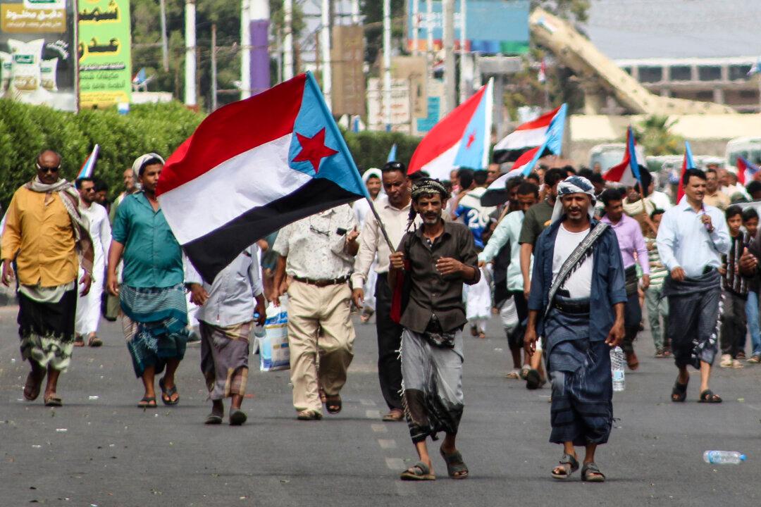 Supporters of the Southern Transitional Council, a coalition of separatist groups seeking to restore the state of South Yemen, wave South Yemen flags during a demonstration calling for the revival of the former independent state, in Aden, Yemen, on Dec. 12, 2025. The UAE-backed Southern Transitional Council last week swept through swathes of Yemen in a near-bloodless takeover they say aimed to expel Islamists and halt smuggling for the benefit of the Iran-backed Houthis. (Saleh Al-Obeidi/AFP via Getty Images)