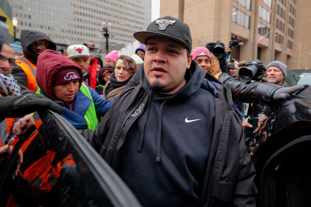 Kilmar Abrego Garcia (C) departs the U.S. Immigration and Customs Enforcement Baltimore Field Office the day after a federal judge ordered his release from detention in Pennsylvania, in Baltimore, Md., on Dec. 12, 2025. Abrego Garcia was granted a temporary restraining order and was released from custody following Friday morning's hearing. A Salvadoran illegal immigrant who had been living in the United States since 2011 and who the Trump administration has said is a member of the Tren de Aragua transnational gang, Abrego Garcia was detained by federal agents and deported to the CECOT prison, a maximum security facility, in El Salvador in March of 2025. (Chip Somodevilla/Getty Images)