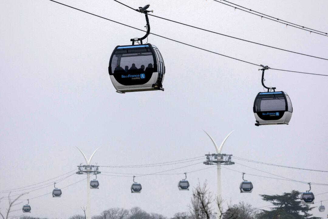 The first urban cable car “C1” in Ile-de-France region during its official launch, in between Creteil Pointe du Lac and Villeneuve-Saint-Georges, on the outskirst of Paris, on Dec. 13, 2025. (Thomas Samson/AFP via Getty Images)