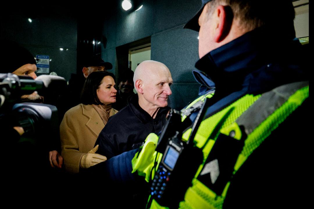 Belarusian Nobel Prize winner Ales Bialiatski is pictured with Belarusian opposition leader and political activist Sviatlana Tsikhanouskaya at the U.S. embassy after he was released in Vilnius, Lithuania, on Dec. 13, 2025. Belarusian street protest leader Maria Kolesnikova and Bialiatski walked free on Dec. 13 with 121 other political prisoners, released in an unprecedented U.S.-brokered deal, rights groups announced. (Petras Malukas/AFP via Getty Images)