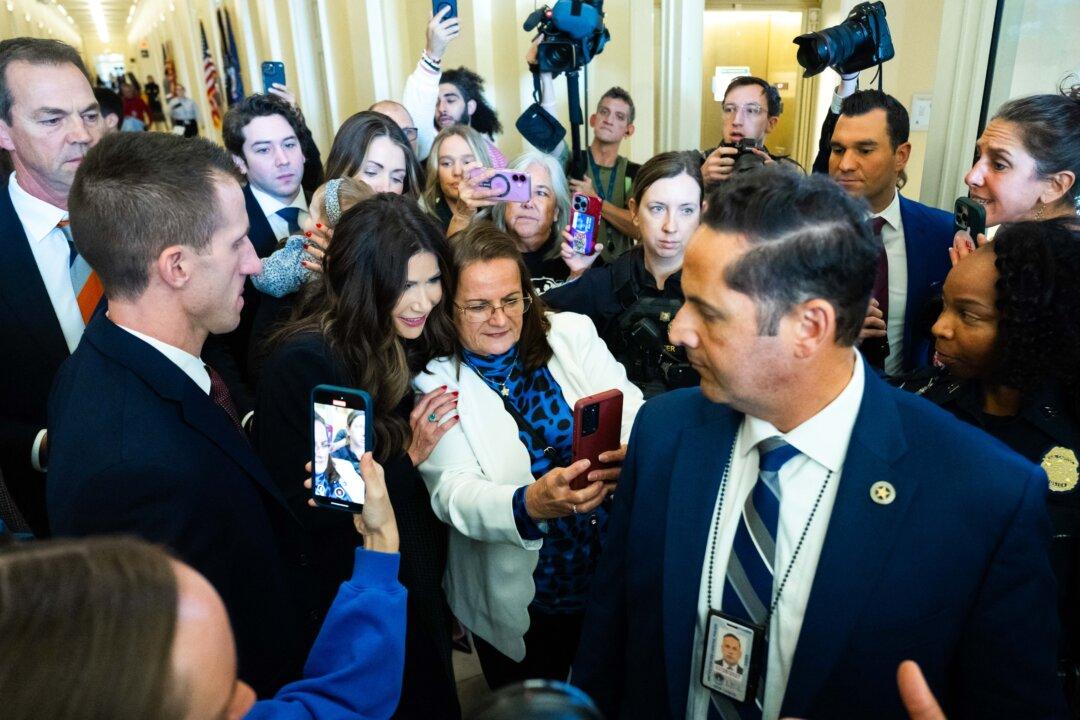 Secretary of Homeland Security Kristi Noem stops for a picture with Agnes Gibboney, whose son was murdered in 2002 by a previously deported illegal immigrant, as she departs after testifying during a House Homeland Security Committee hearing on Capitol Hill in Washington on Dec. 11, 2025. Noem said that the U.S. seizure of an oil tanker the day before targeted Venezuelan leader Nicolas Maduro’s regime, which she accused of trafficking drugs to the United States. (Saul Loeb/AFP via Getty Images)