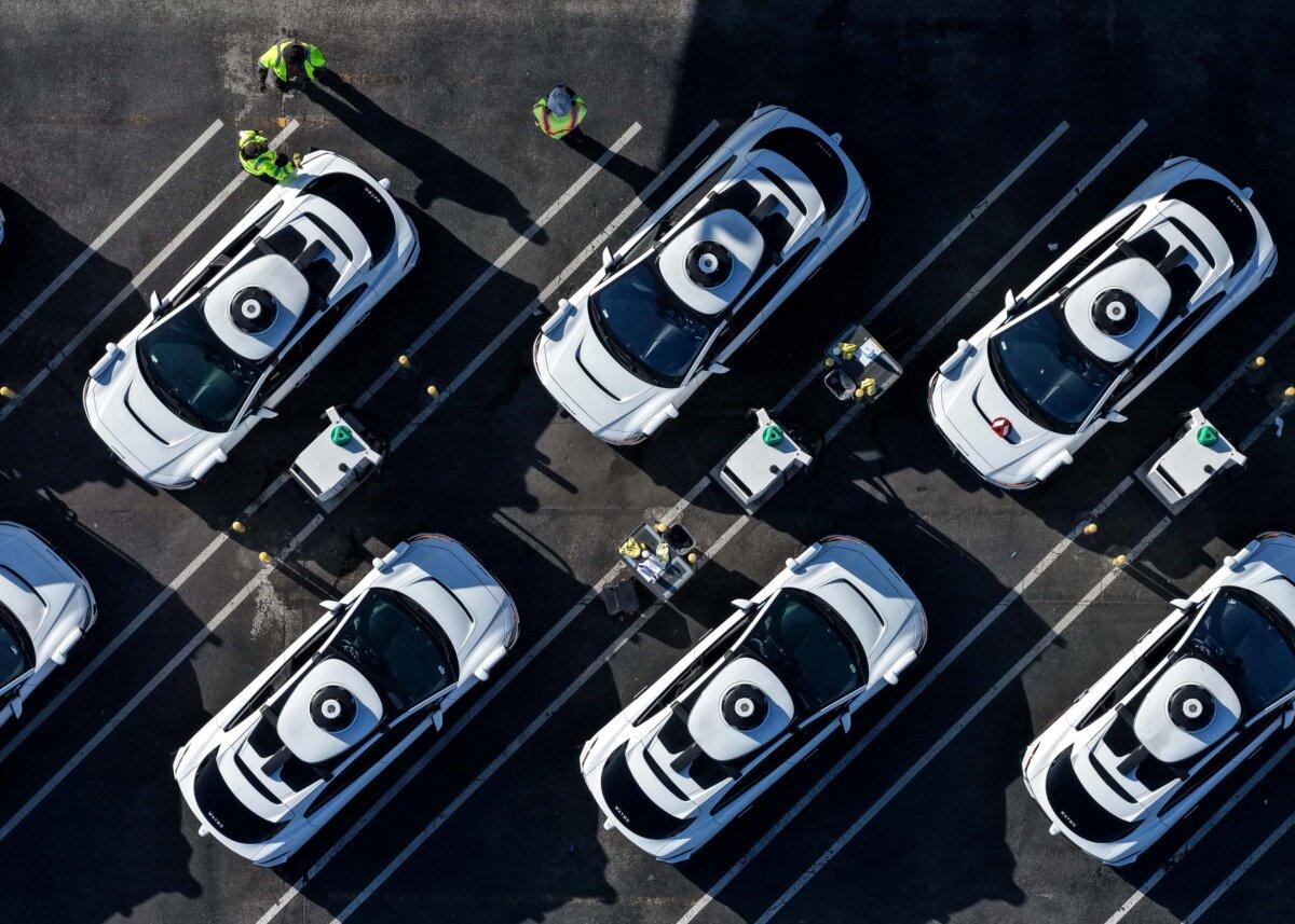 Waymo robotaxis sit parked at a Waymo facility in San Francisco on Dec. 8, 2025. (Justin Sullivan/Getty Images)