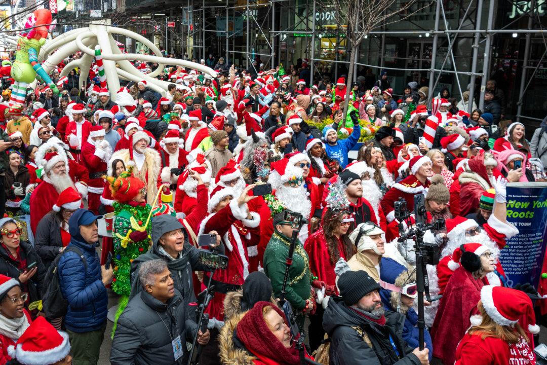 Revelers gather wearing holiday character costumes during the SantaCon bar crawl in New York City on Dec. 13, 2025. (Jeremy Weine/Getty Images)
