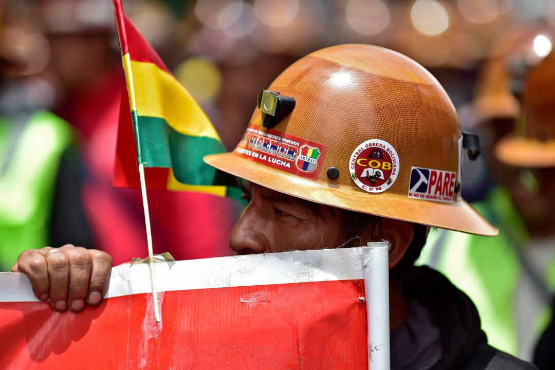 A member of the Bolivian Workers' Central marches against fuel subsidy cuts in La Paz on Dec. 22, 2025. Bolivia's new government announced on Dec. 17 that it will cut fuel subsidies, ending 20 years of fixed prices. (Jorge Bernal/AFP via Getty Images)