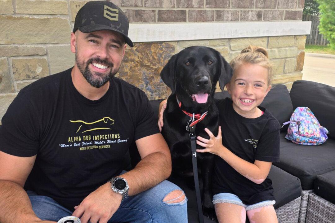 Coltin and Cami Cunningham with JoJo, the mold-sniffing dog. (Photo by Megan Cunningham)