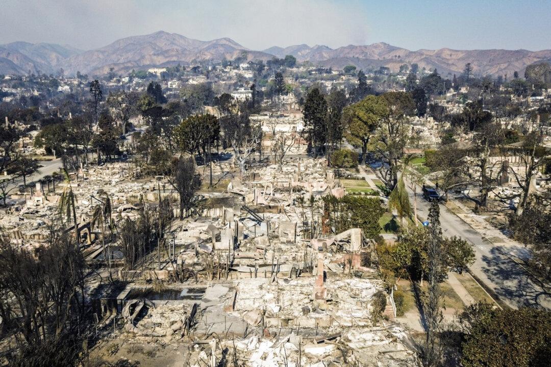 A neighborhood is destroyed by the Palisades Fire near Los Angeles on Jan. 9, 2024. (John Fredricks/The Epoch Times)