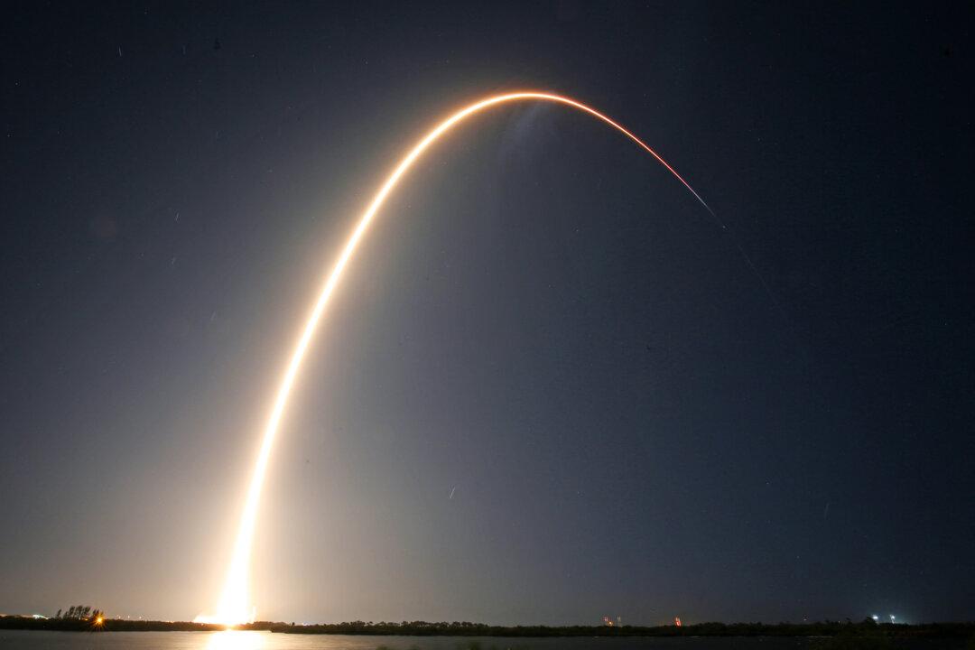 A SpaceX Falcon 9 rocket carrying Firefly Aerospace's Blue Ghost and ispaceÕs Resilience lunar landers streaks into orbit after lifting off from Launch Complex 39A at the Kennedy Space Center in Cape Canaveral, Fla., on Jan. 15, 2025. (Gregg Newton/AFP via Getty Images)