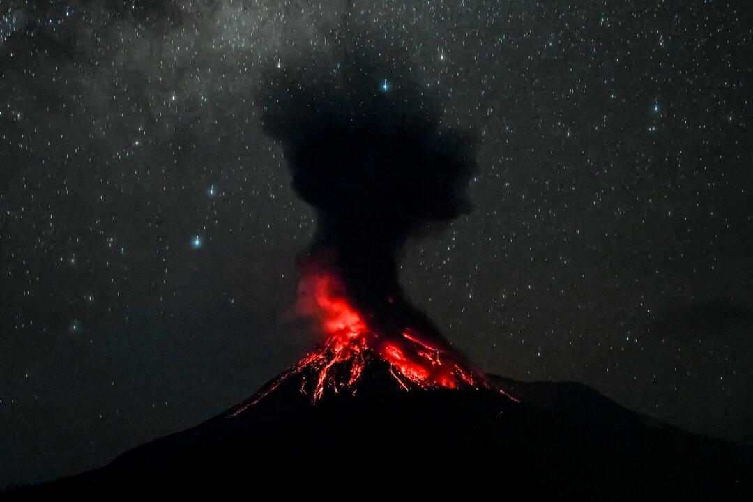 Mount Lewotobi Laki-Laki erupts as seen from Pululera village in East Flores, in Nobo, Indonesia, on May 19, 2025. The volcano in eastern Indonesia spewed an ash cloud more than a 33,000 feet high after authorities raised the country's highest alert level. (Arnold Welianto/AFP via Getty Images)