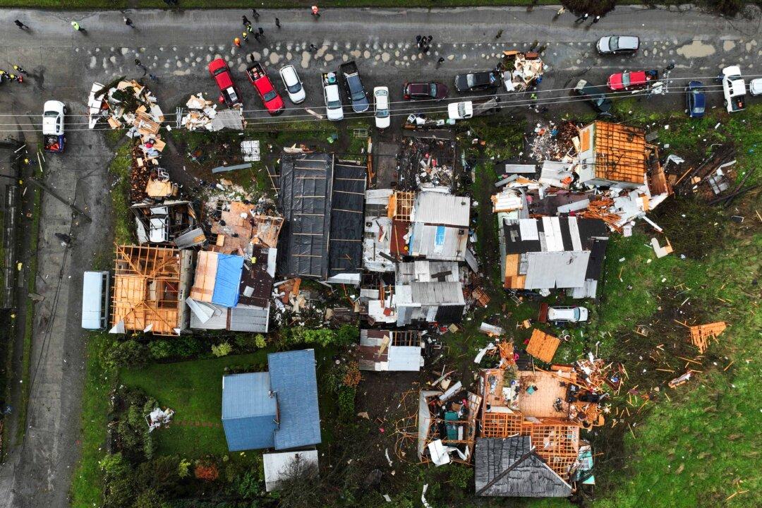 An aerial view of the damages following the passage of a tornado in the city of Puerto Varas, Region de los Lagos, southern Chile, on May 26, 2025. An unusual tornado rated as category EF-1 hit the city of Puerto Varas, about 620 miles south of Santiago, leaving eight people injured and some 150 homes affected, authorities said. (Javier Torres/AFP via Getty Images)