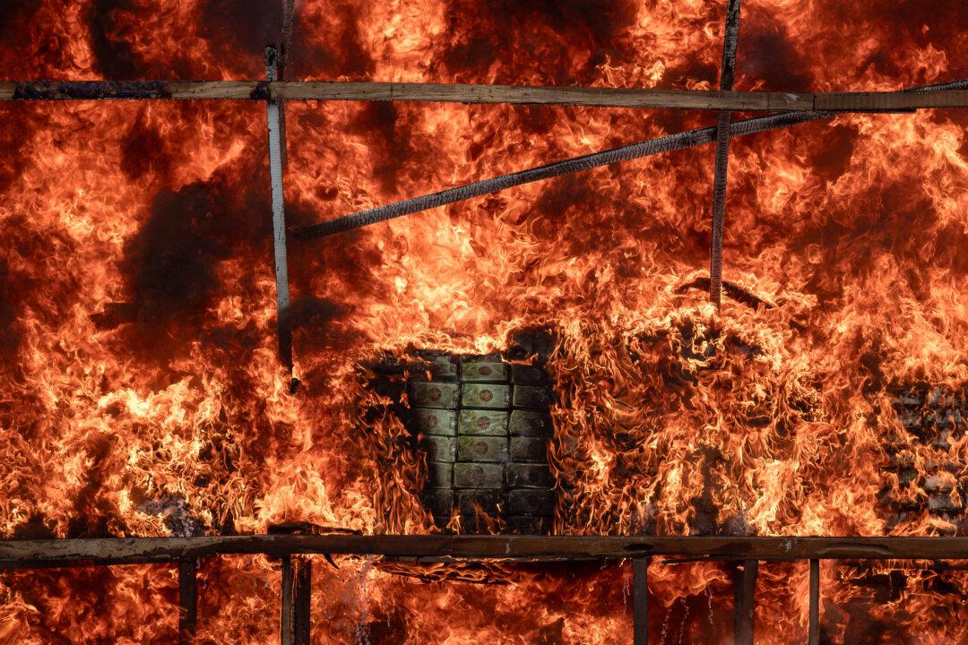 A burning pile of seized illegal drugs is seen during a destruction ceremony to mark the International Day Against Drug Abuse and Illicit Trafficking in Yangon, Burma, on June 26, 2025. (Sai Aung Main/AFP via Getty Images)