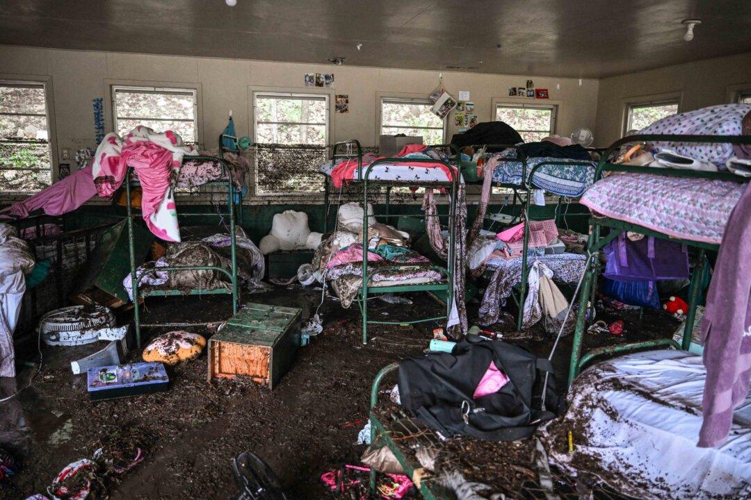 A view inside a cabin at Camp Mystic, the site where at least 20 girls went missing after flash flooding in Hunt, Texas, on July 5, 2025. Rescuers were searching for more than 20 girls missing from a riverside summer camp after torrential rains caused devastating flooding that killed more than 100 people. (Ronaldo Schemidt/AFP via Getty Images)