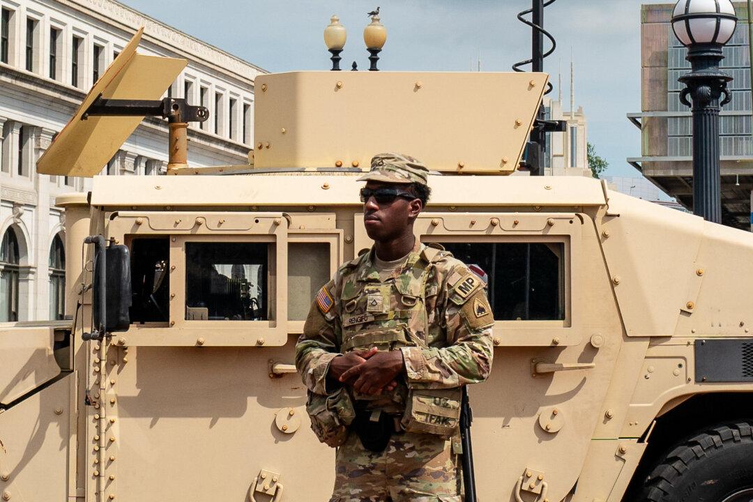 A member of the National Guard patrol at Union Station in Washington on Aug. 14, 2025. The Trump administration has deployed the National Guard to assist in crime prevention in the nation's capital. (Madalina Kilroy/The Epoch Times)