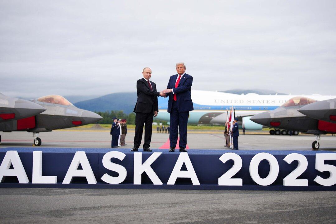 U.S. President Donald Trump (R) greets Russian President Vladimir Putin (L) as he arrives at Joint Base Elmendorf-Richardson in Anchorage, Alaska, on Aug. 15, 2025. The two leaders met for peace talks aimed at ending the Russia-Ukraine war. (Andrew Harnik/Getty Images)