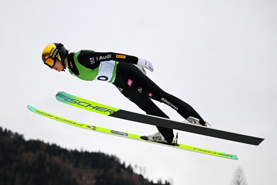 Jessica Malsiner of Team GS Fiamme Gialle competes during the Italian National Championship Open at Predazzo Ski Jumping Stadium in Predazzo, Italy, on Dec. 23, 2025. (Mattia Ozbot/Getty Images)