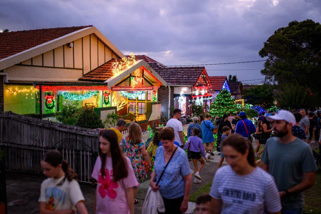 Houses display Christmas lights on Second Street in Ashbury in Sydney on Dec. 23, 2025. (George Chan/Getty Images)