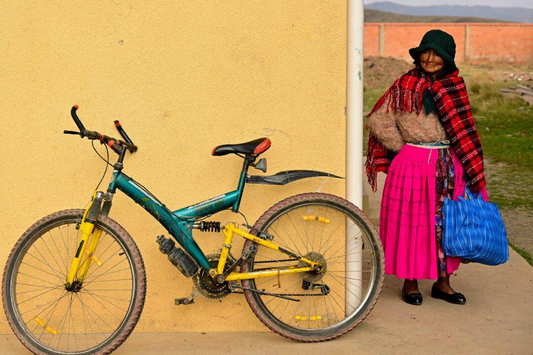 An Aymara woman waits to vote at a polling station during the presidential runoff election in Laja, some 18 miles west of La Paz, Bolivia, on Oct. 19, 2025. (Martin Bernetti/AFP via Getty Images)
