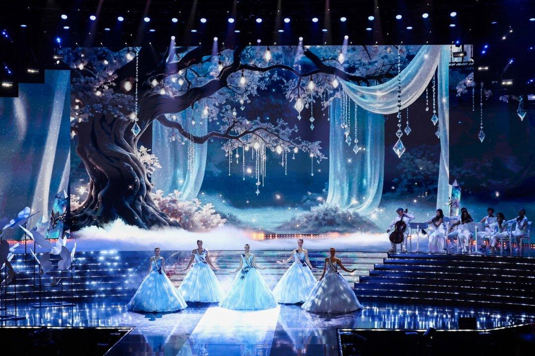 (L-R) The five finalists, Miss Normandie Victoire Dupuis, Miss Guadeloupe Naomi Torrent, Miss Roussillon Deborah Adelin-Chabal, Miss Tahiti Hinaupoko Deveze, and Miss Nouvelle-Caledonie Juliette Collet, perform on stage during the Miss France 2026 beauty pageant at the Zenith in Amiens, northern France, on Dec. 6, 2025. (Sameer Al-Doumy/AFP via Getty Images)