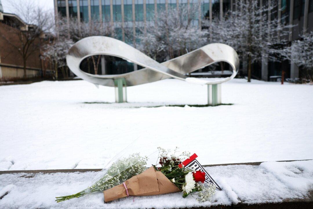 A bouquet is left outside of the engineering and physics building at Brown University, the site of a mass shooting that left two people dead and nine others injured in Providence, R.I., on Dec. 14, 2025. (Spencer Platt/Getty Images)