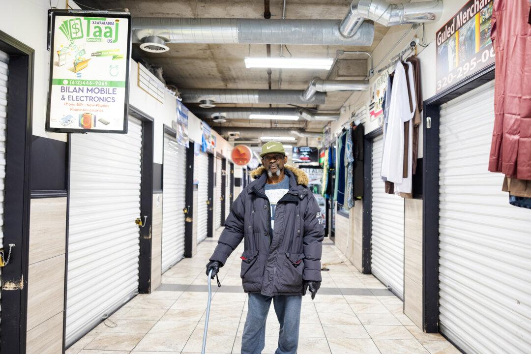 A portrait of Mark Nelson at Karmel Mall in Minneapolis on Dec. 9, 2025. Nelson said he can’t stand seeing people come into America and “siphon so much out of the state.” (Jenn Ackerman for The Epoch Times)