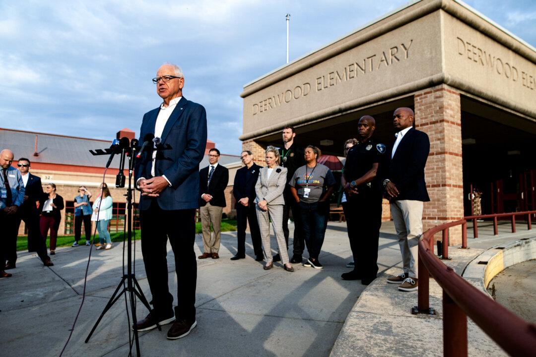 Minnesota Gov. Tim Walz (L) speaks to the media at Deerwood Elementary in Eagan, Minn., on Sept. 2, 2025. Walz said he considers federal prosecutors to be “partners” who hold criminals accountable. (Stephen Maturen/Getty Images)