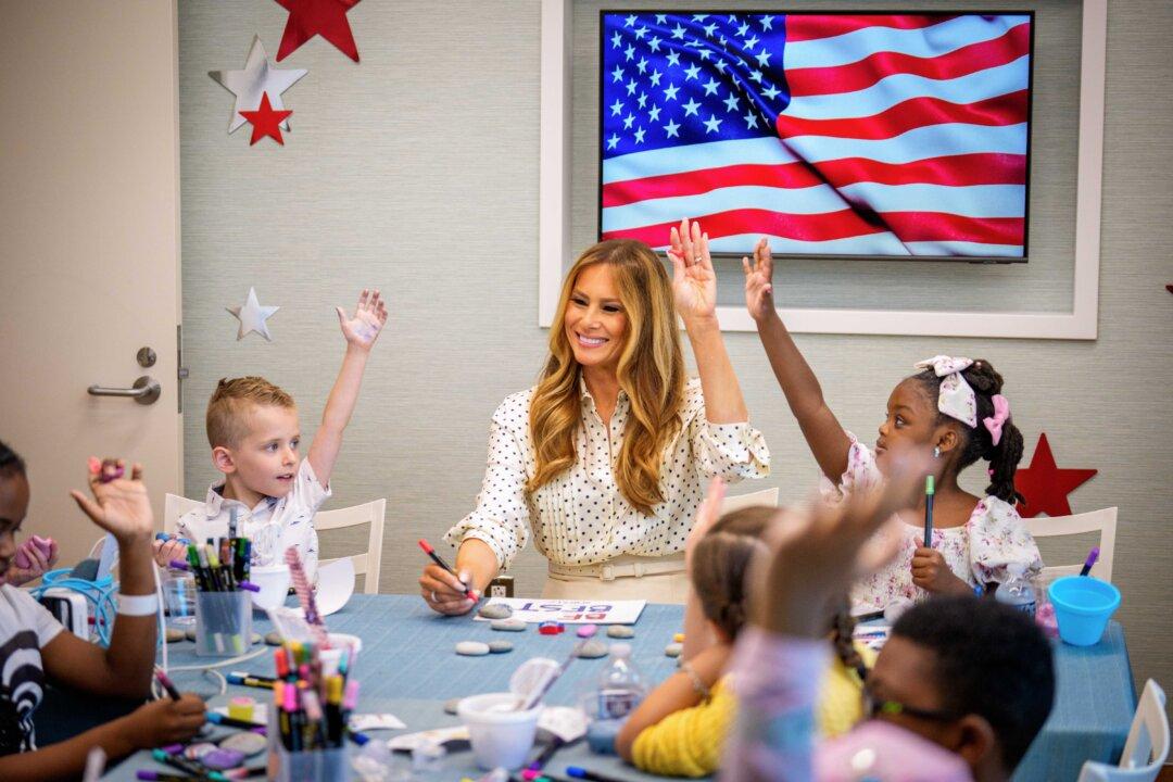 First Lady Melania Trump visits with children at Children's National Hospital in Washington on July 3, 2025. She visited the hospital the day before the July 4th holiday to greet patients, participate in arts and crafts, see a hybrid tea rose bush planted from the White House in the hospital's Bunny Mellon Healing Garden, and visit with a 3-month old transplant patient and his family. (Andrew Harnik/Getty Images)