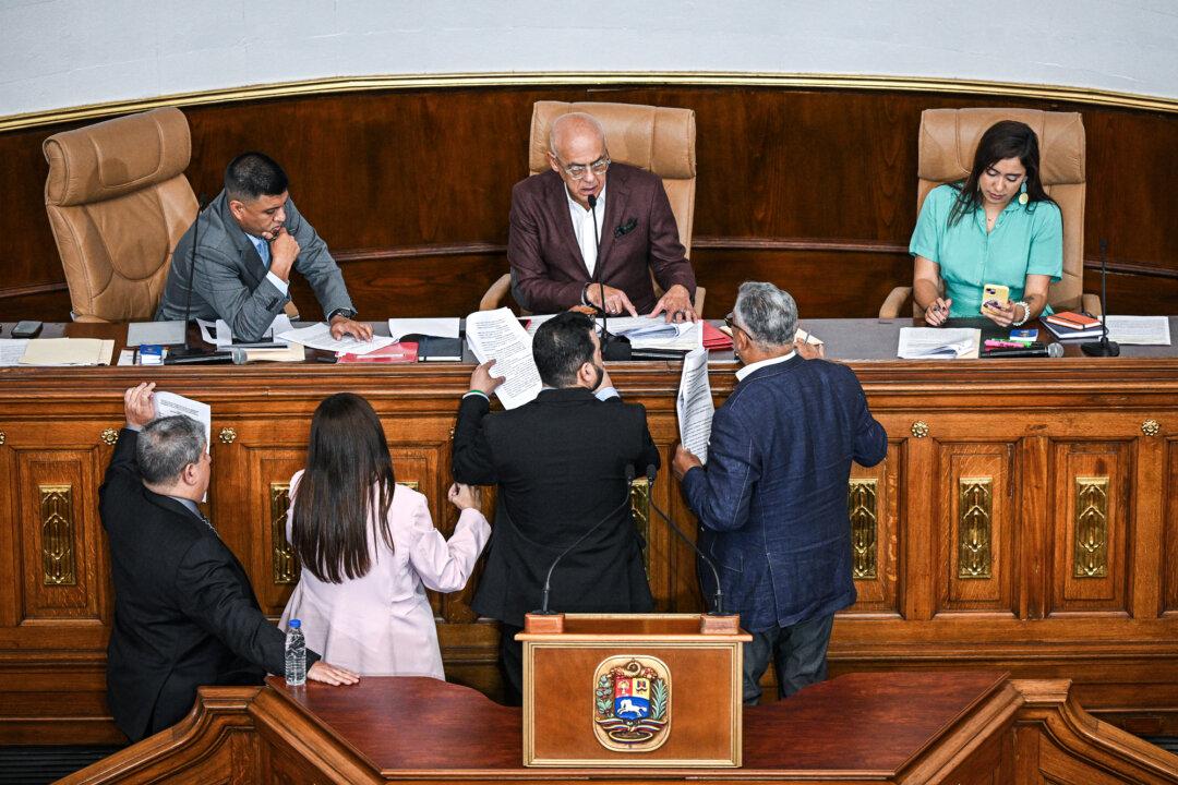 Venezuelan National Assembly President Jorge Rodriguez (top C), First Vice President Pedro Infante (top L), and Second Vice President America Perez (top R) discuss a law with other lawmakers during an extraordinary session at the National Assembly in Caracas on Dec. 23, 2025. The Venezuelan parliament on Dec.23 passed a law imposing lengthy prison terms on any national who supports a United States' oil tanker blockade. (Federico Parra / AFP via Getty Images)