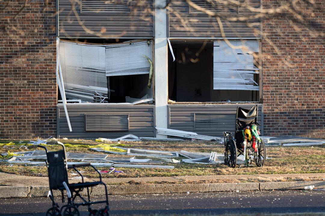 Wheelchairs and other debris are scattered amid structurally damaged buildings after a massive explosion and fire caused a collapse at a nursing home in Bristol, Pa., on Dec. 24, 2025. (Jose F. Moreno/The Philadelphia Inquirer via AP)