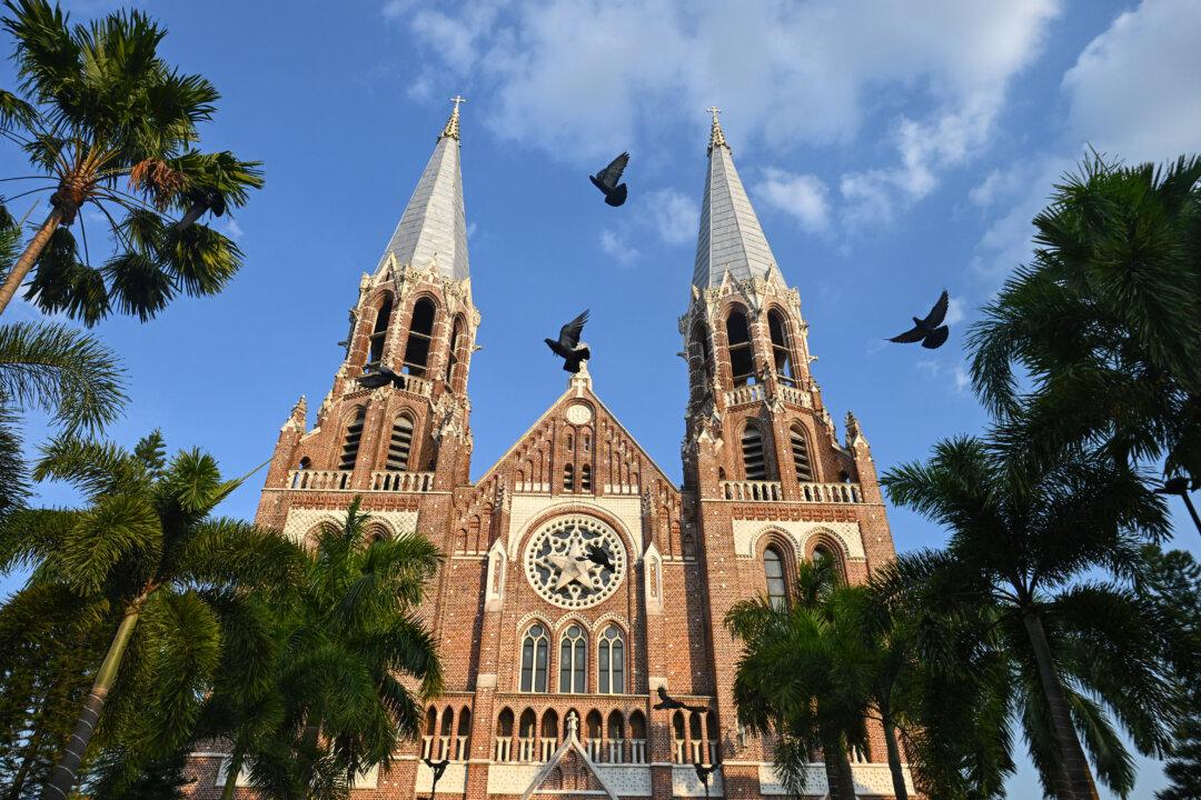 Birds fly past the St. Mary's Cathedral during a Christmas Eve mass in Yangon, Burma, on Dec. 24, 2025. (Sai Aung Main/AFP via Getty Images)