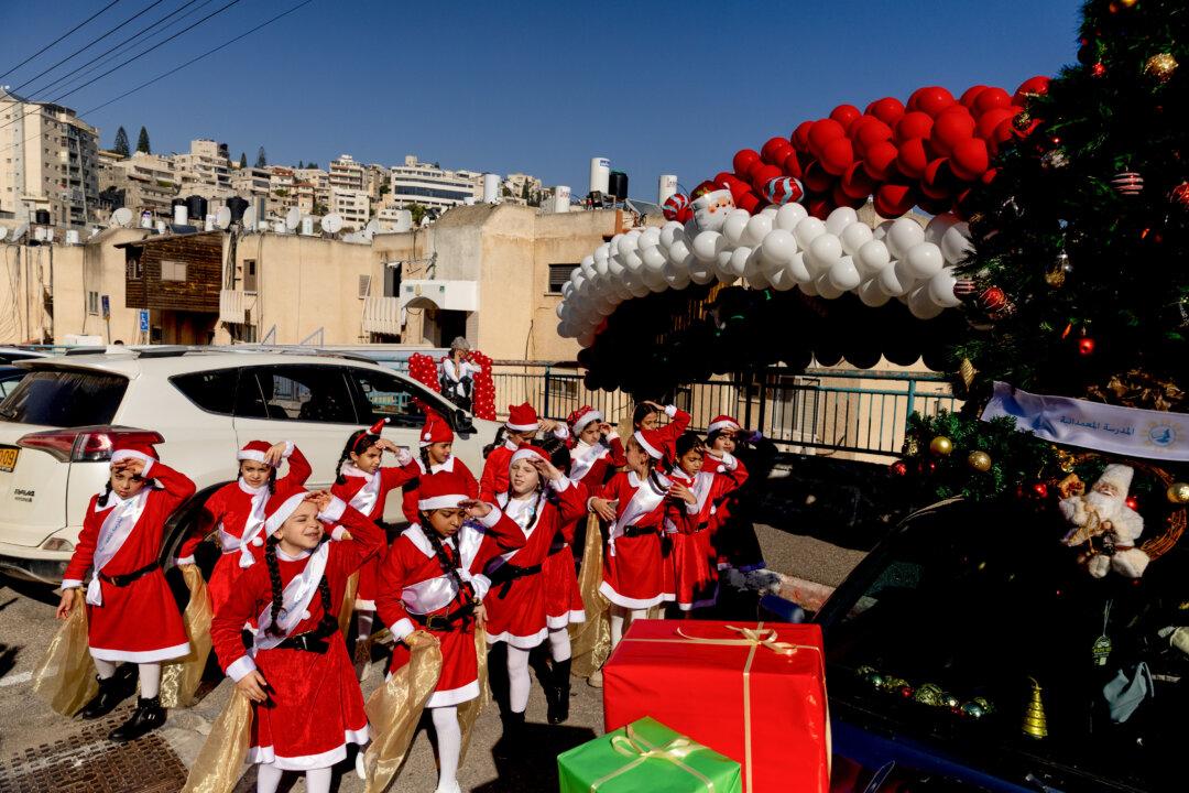 Girls wearing Santa Claus costumes practice before taking part in the 40th annual Christmas parade in Nazareth, Israel, on Dec. 24, 2025. Nazareth, the purported childhood home of Jesus according to the New Testament, has seen a return of Christmas season tourism this year after two years in which celebrations were muted amid the war in Gaza. Nazareth, in Israel's Galilee region, is a predominately Arab and Muslim town, about one-third of whose residents are Christian. (Amir Levy/Getty Images)