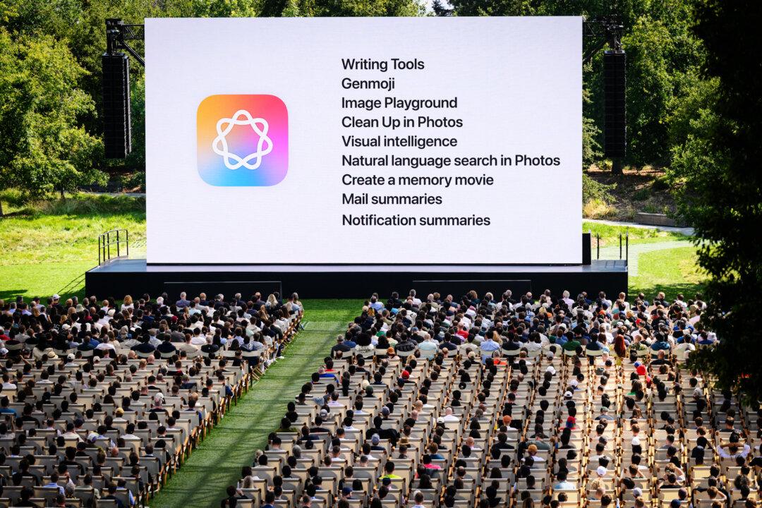 Apple announces upgrades to its artificial intelligence system, “Apple Intelligence,” during the annual Apple event at the company's corporate headquarters in Cupertino, Calif., on June 9, 2025. Apple is among the top five companies on the S&P 500 that are heavily invested in artificial intelligence. (Josh Edelson/AFP via Getty Images)