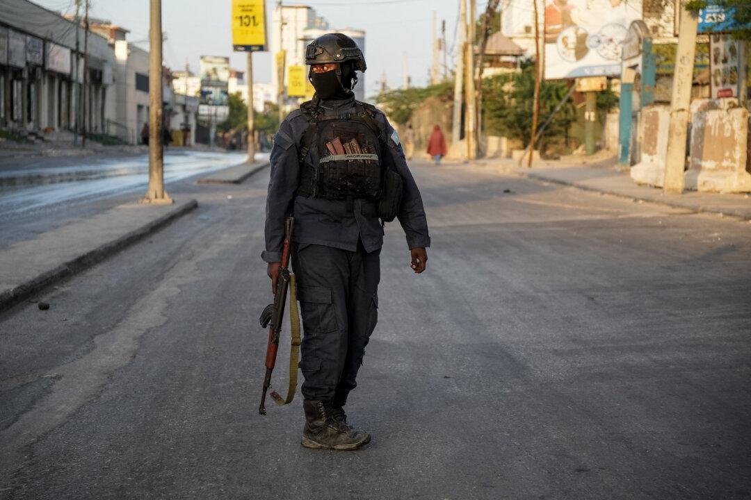 A member of the Somalia Security forces patrols in the street during local council elections in Mogadishu, on Dec. 25, 2025. Somalia's capital heads to the polls on Dec. 25 for local elections, the first time in 58 years, under a complete citywide lockdown amid security concerns. (Hassan Ali Elmi/AFP via Getty Images)