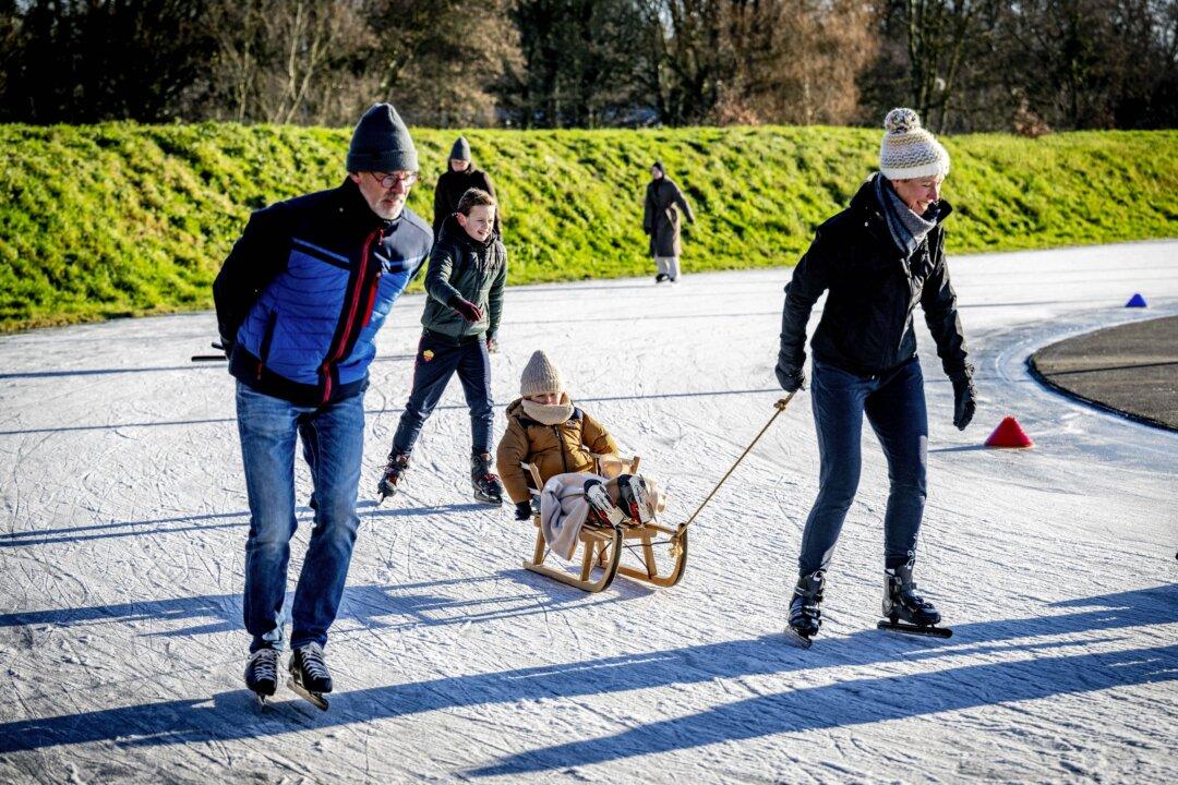 Skating enthusiasts skate on Christmas Day on a natural ice rink in Zeist, Netherlands, on Dec. 25, 2025. (Robin Utrecht/ANP/AFP via Getty Images)