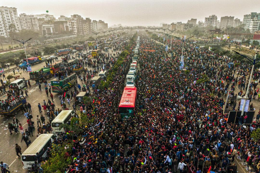 An aerial view shows supporters gathered around a convoy carrying Tarique Rahman, son of former prime minister Khaleda Zia and Bangladesh Nationalist Party (BNP)'s acting chairman, during a rally after his arrival in Dhaka, on Dec. 25, 2025. Aspiring prime minister and political heavyweight Rahman returned to Bangladesh on Dec. 25, ending 17 years in self-imposed exile with a promise to deliver safety and justice if his party wins next year's elections. (Ariful Amin/AFP via Getty Images)