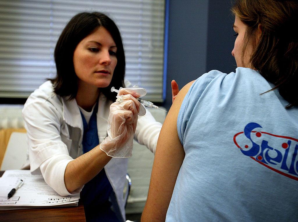 A nurse administers a flu vaccine in New York City on Nov. 11, 2002. (Robert Giroux/Getty Images)