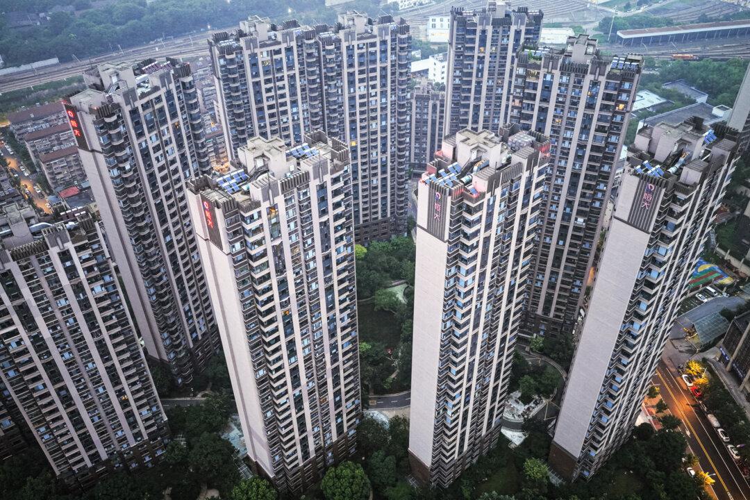 An aerial view of apartment buildings developed by the China Evergrande Group in Nanjing, Jiangsu Province, China, on Aug. 13, 2025. Rhodium Group has estimated that China’s household consumption percentage of GDP remains well below OECD countries—making it harder for China to replace reduced external demand with domestic spending. (STR/AFP via Getty Images)