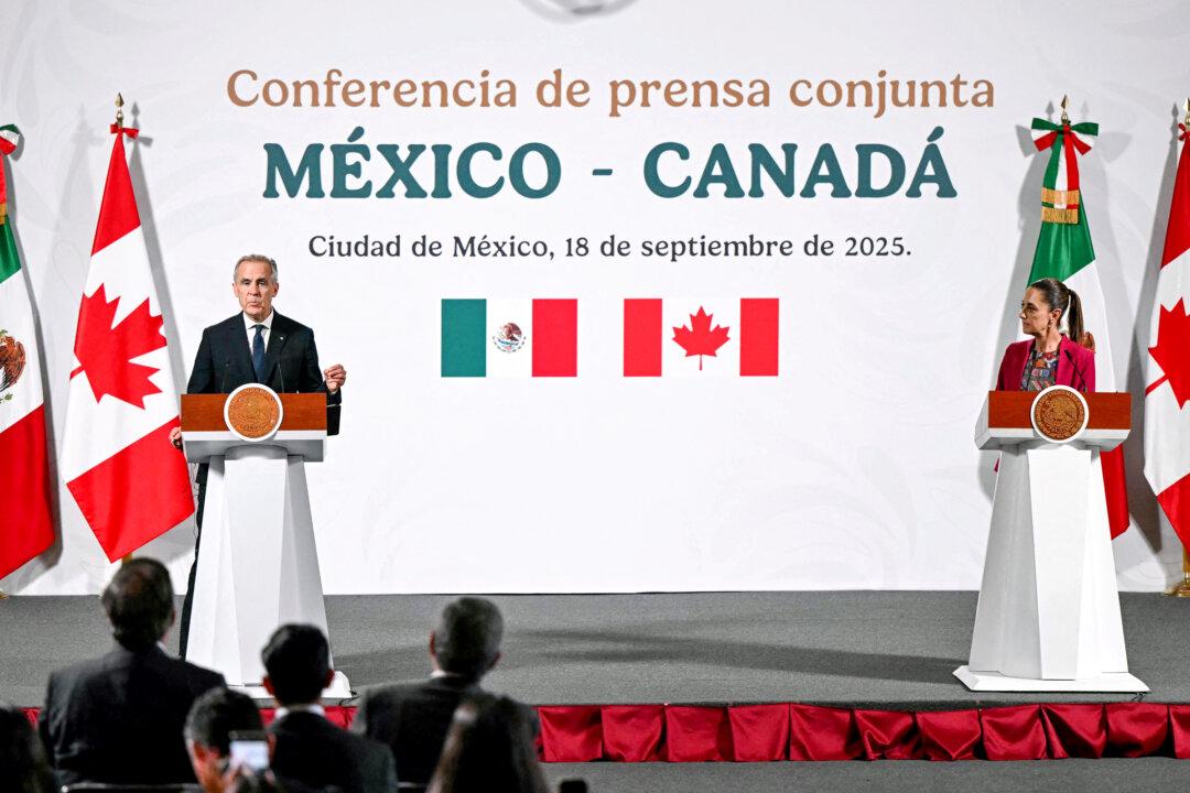 Canadian Prime Minister Mark Carney (L) and Mexican President Claudia Sheinbaum hold a joint news conference at the National Palace in Mexico City, Mexico, on Sept. 18, 2025. U.S. Trade Representative Jamieson Greer has said Mexico and Canada should not serve as export hubs for Chinese and other Asian goods. (Yuri Cortez/AFP via Getty Images)