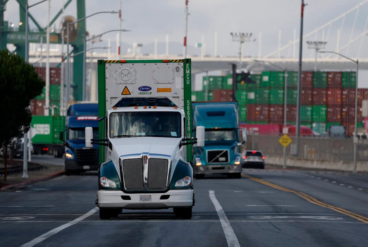 Trucks drive through the port of Oakland, Calif., on Nov. 14, 2025. (Justin Sullivan/Getty Images)
