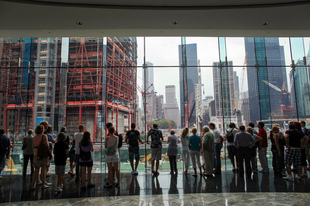 People watch construction at the World Trade Center site in New York City on Aug. 16, 2010. The proposed mosque and Islamic cultural center, known as Park51, drew sharp criticism in 2009 over plans to locate it near the site of the 9/11 terrorist attacks in the New York City borough of Manhattan. (Spencer Platt/Getty Images)