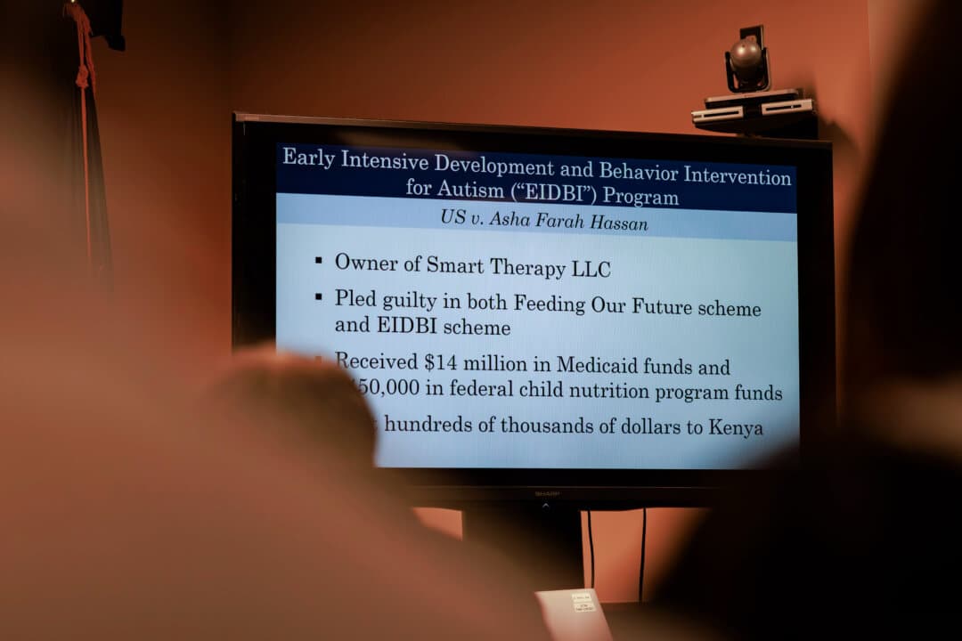 A slide outlining details of an autism service fraud scheme is displayed during a news conference by the U.S. Attorney’s Office at the U.S. District Court in Minneapolis on Dec. 18, 2025. (Kerem Yucel/Minnesota Public Radio via AP)